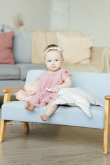 Portrait of cute little baby girl at home. Nice child. 