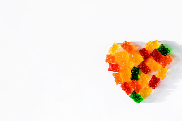 Heart shaped colored gelatins on a white background