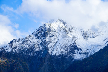 Cloud covered holy peaks of Kinner kailash Mountains of Himalaya seen from Kalpa Himachal Pradesh India
