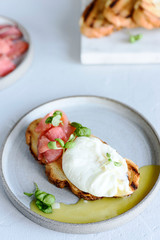 Toast with salmon, poached egg and basil. Morning and Breakfast. Healthy nutrition. Selective focus