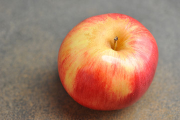 apple whole on a gray background