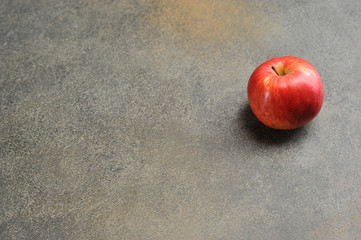 red Apple on a gray background - top view