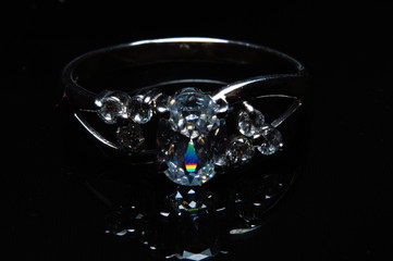 silver ring with stones on a black background