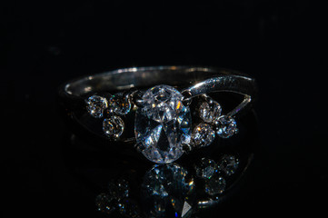 Silver ring with stones on a black background