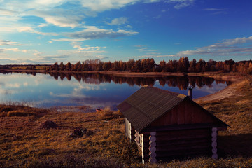 Bathhouse by the lake russia autumn