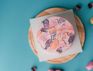 Birthday cake colourful concept on wooden plate and blue sky colour background.food concept.