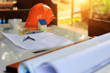 Desk of Architectural working project in construction site,With drawing equipment concept.