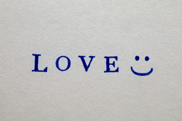 a love word stamped on a piece of paper.