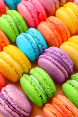 Many tasty macarons as background