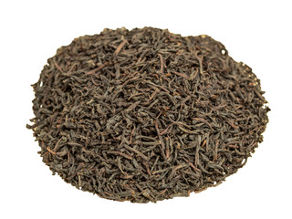 Dry brewed tea in a glass plate on a wooden background