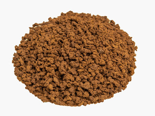 Granulated coffee in a glass plate on a wooden background