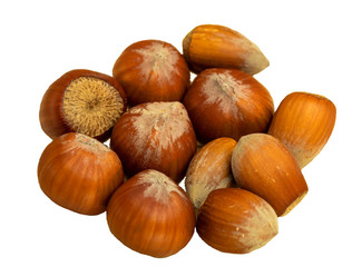 Hazelnuts in a glass plate on a wooden background