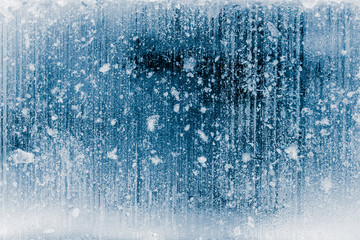 Textured frosty ice block surface background, blue toned.