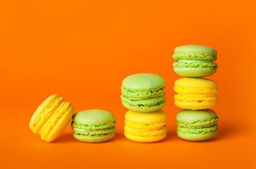 Tasty macarons on color background