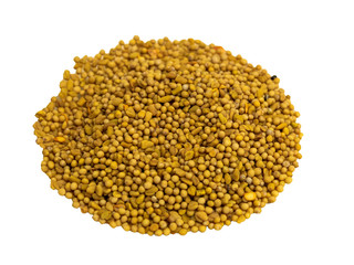 Mustard seed seasoning in glass plate on wooden background