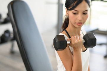 Fototapeta na wymiar young woman workout in the gym
