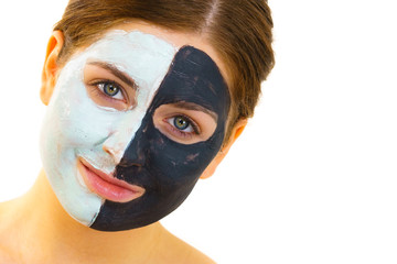 Girl with black white mud mask on face