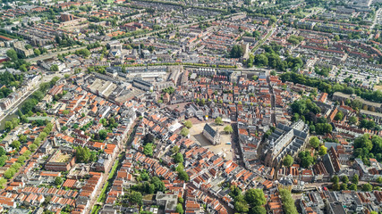 Aerial drone view of Delft town cityscape from above, typical Dutch city skyline with canals and houses, Holland, Netherlands