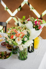 Bouquets, spring flowers in vases on the table