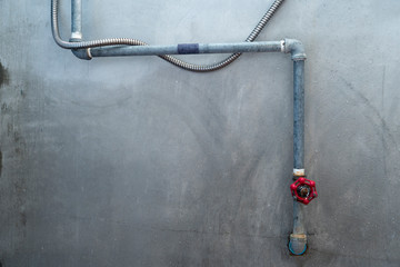 Water pipe and valve on Cement wall in Shower room.