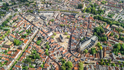 Aerial drone view of Delft town cityscape from above, typical Dutch city skyline with canals and houses, Holland, Netherlands