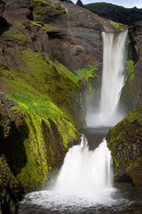 Fototapeta premium Beautiful smooth waterfall in Iceland during sunny day