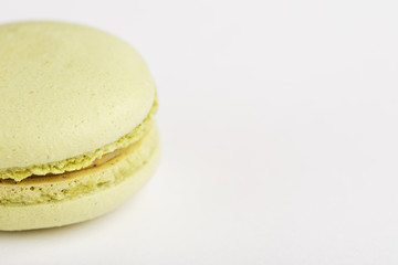 Green macaroni Cookies on a white background, isolated.
