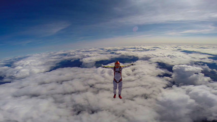 Celebration. A man makes the first parachute jump. The first step into the abyss.