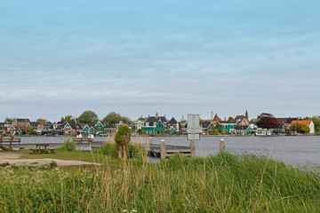 View of traditional Dutch houses along the canal in spring at the Zaanse Schans, Zaandam, Netherlands