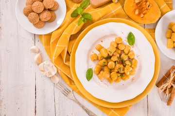 Pumpkin gnocchi with grated amaretti cookies.
