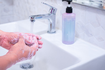 Close-up of handwashing. Protection pandemic minimalist. Prevention hygiene to stop spreading from Coronavirus(COVID-19) or 2019-nCoV. By properly wash hands rubbing and fingers with soap frequently.