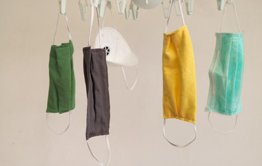 Closeup of face masks drying after cleaning and washing, by outdoor wind and sunlight. Common practice during corona virus outbreak around the World.