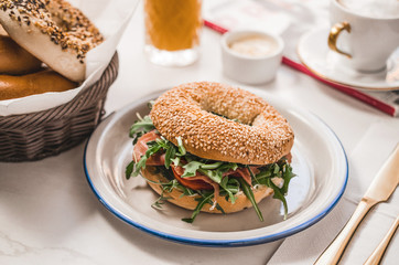 Breakfast tabl with bagel with coffee and juice
