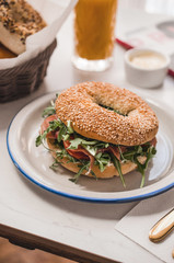 Breakfast tabl with bagel with coffee and juice