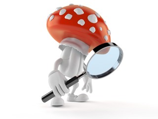 Fototapeta premium Toadstool character looking through magnifying glass