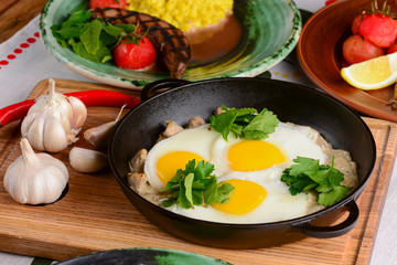 Fried egg with green spinach in pan, healthy breakfast. Healthy food.