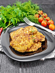 Fritters meat in plate on black board
