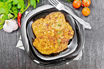 Fritters meat in plate on board top