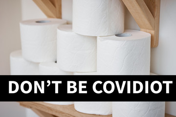 Buying panic for home quarantine due to coronavirus. Stay at home for covid-19 protection concept. Stocks of toilet paper rolls on shelf
