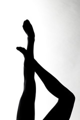 Silhouette of ballet dancer's legs