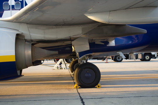 evocative detail image of the wheel and turbine of a 737 airplane in the parking area