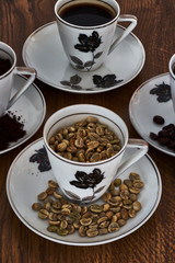 Vintage coffee cups with coffee beans