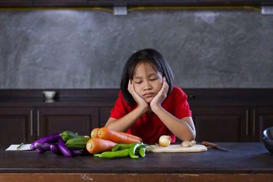 Young Asian Girl Look At Vegetable With Bored Face, Hate Vegetable And Failue Cooking Concept.