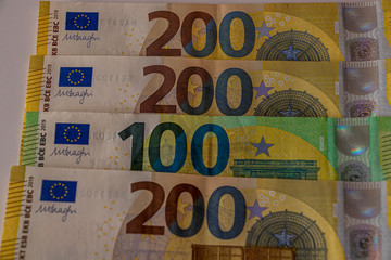 A few 200 euro bills and one 100 note, close up