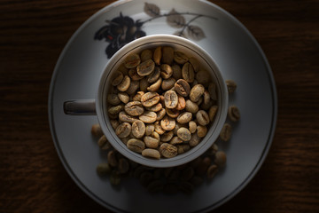 Vintage cup and saucer with coffee beans