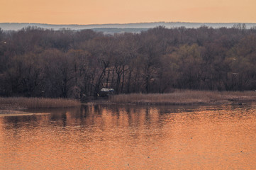 Island on the river in early spring	