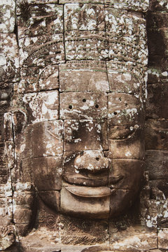 Buddha head on towers of Bayon temple in Angkor Thom, Cambodia