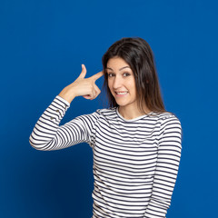 Fototapeta premium Brunette young woman wearing a striped T-shirt