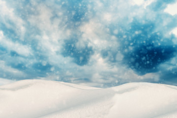 Fototapeta na wymiar Winter Heavy Clouds on Sky. Snow Dunes and Snowfall Background.