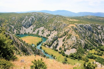 Fototapeta na wymiar valley and bend in the blue Krupa river, Croatia